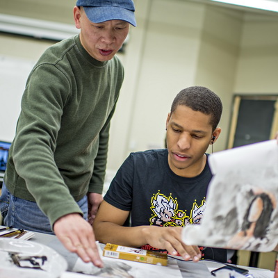 Art instructor with student